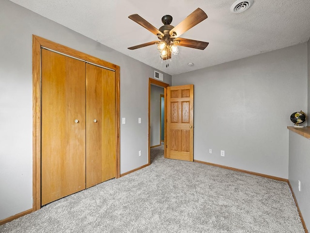 6735 378th St, North Branch, MN 55056 - unfurnished bedroom featuring carpet, a closet, ceiling fan, and a textured ceiling