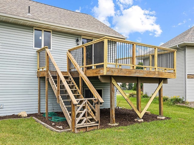 6735 378th St, North Branch, MN 55056 - back of property featuring a deck, a shingled roof, and a yard