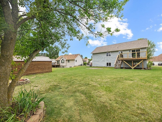 6735 378th St, North Branch, MN 55056 - view of grassy yard with a wooden deck and stairs