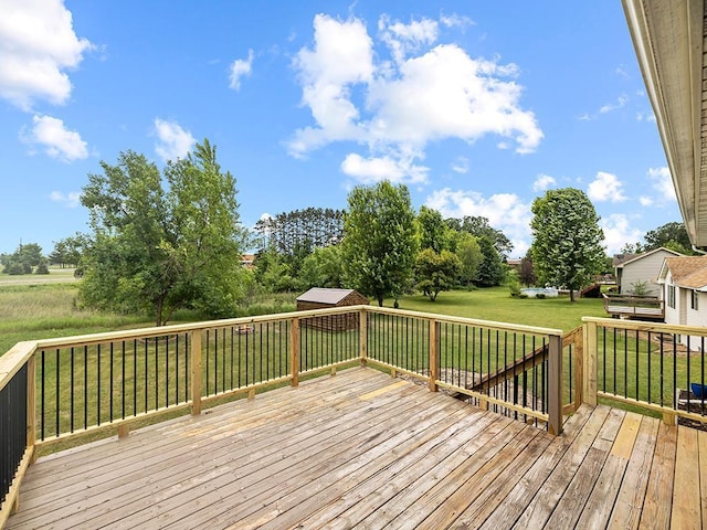 6735 378th St, North Branch, MN 55056 - wooden deck featuring a yard and a storage unit