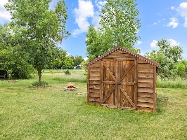 6735 378th St, North Branch, MN 55056 - view of shed featuring an outdoor fire pit
