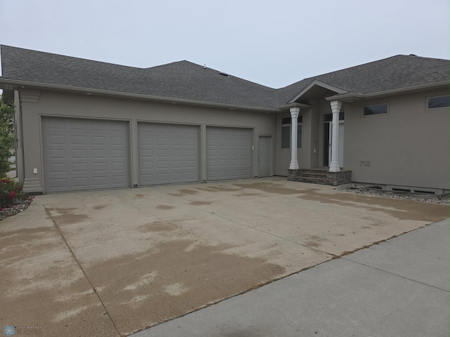 716 Northridge Way W, Fargo, ND 58078 - view of front of home featuring stucco siding, an attached garage, driveway, and a shingled roof