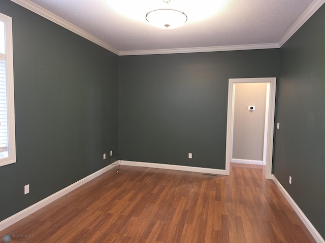 716 Northridge Way W, Fargo, ND 58078 - empty room with wood finished floors and ornamental molding