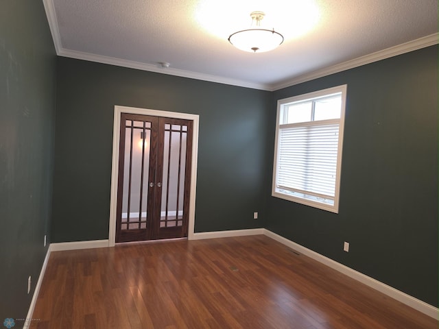 716 Northridge Way W, Fargo, ND 58078 - unfurnished room with wood finished floors, ornamental molding, and a smoke detector