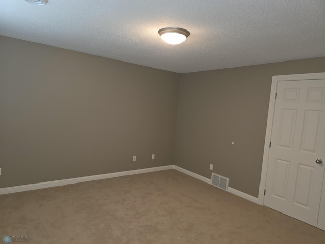 716 Northridge Way W, Fargo, ND 58078 - unfurnished room featuring light carpet and a textured ceiling