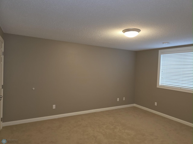 716 Northridge Way W, Fargo, ND 58078 - spare room featuring light colored carpet and a textured ceiling