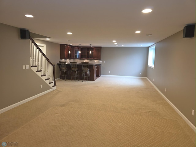 716 Northridge Way W, Fargo, ND 58078 - below grade area with wet bar, recessed lighting, light colored carpet, and stairs