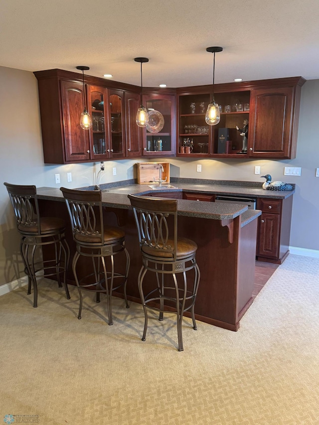 716 Northridge Way W, Fargo, ND 58078 - indoor wet bar featuring hanging light fixtures and light colored carpet
