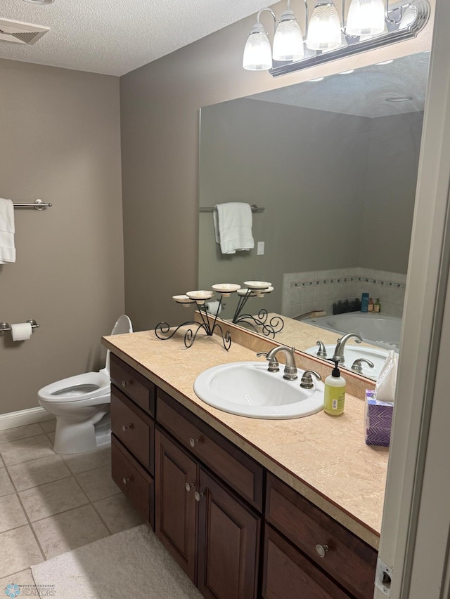716 Northridge Way W, Fargo, ND 58078 - full bathroom with vanity, tile patterned floors, a bath, and a textured ceiling