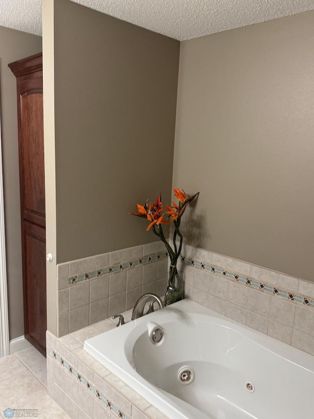 716 Northridge Way W, Fargo, ND 58078 - full bathroom with a textured ceiling, a jetted tub, and tile patterned floors