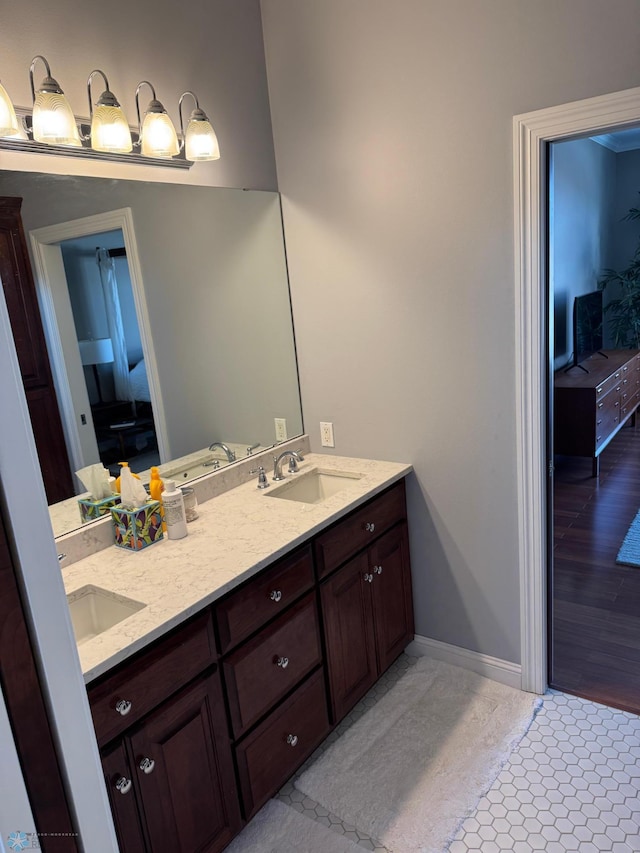 716 Northridge Way W, Fargo, ND 58078 - full bath with double vanity and baseboards