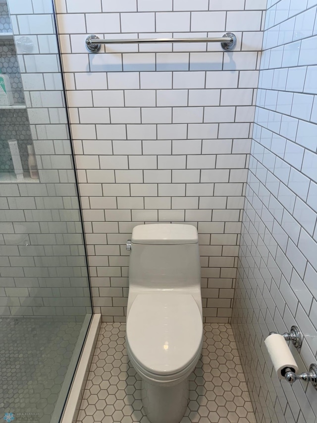 716 Northridge Way W, Fargo, ND 58078 - full bath with tile patterned flooring, a shower stall, and tile walls