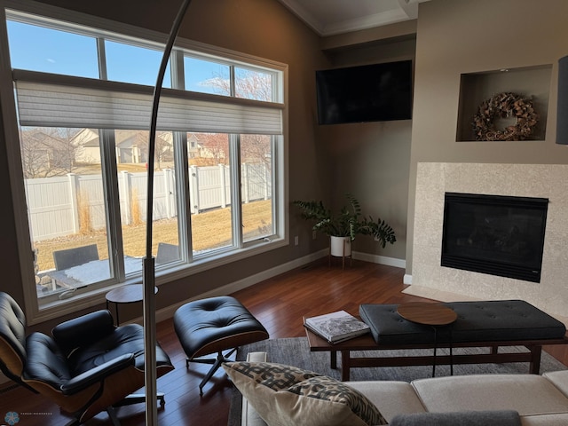 716 Northridge Way W, Fargo, ND 58078 - living room with dark wood-style floors, ornamental molding, and a fireplace with flush hearth