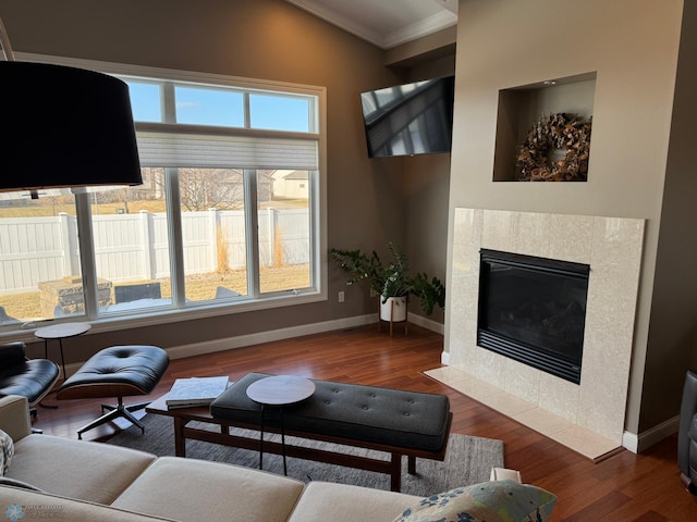 716 Northridge Way W, Fargo, ND 58078 - living area featuring ornamental molding, wood finished floors, and a tile fireplace