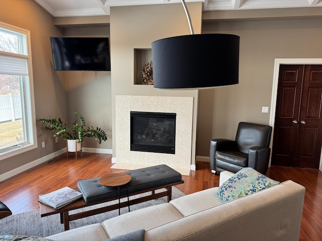 716 Northridge Way W, Fargo, ND 58078 - living room featuring crown molding, wood finished floors, a tile fireplace, beam ceiling, and coffered ceiling