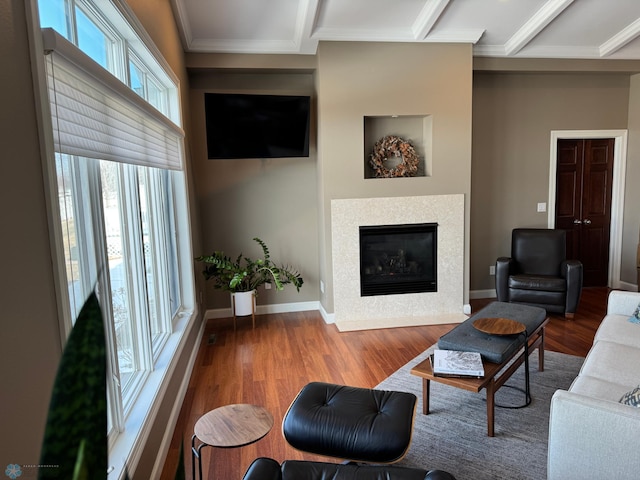 716 Northridge Way W, Fargo, ND 58078 - living room with a fireplace with flush hearth, wood finished floors, and ornamental molding
