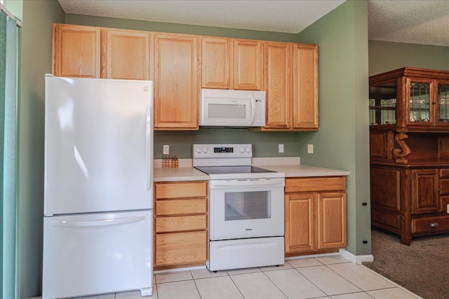 16901 90th Ct N, Maple Grove, MN 55311 - kitchen with white appliances, light countertops, light brown cabinets, light tile patterned floors, and a textured ceiling