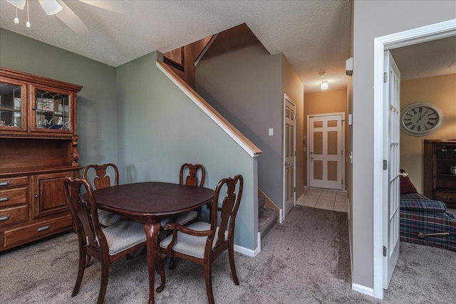 16901 90th Ct N, Maple Grove, MN 55311 - dining space with light colored carpet, stairs, a ceiling fan, and a textured ceiling
