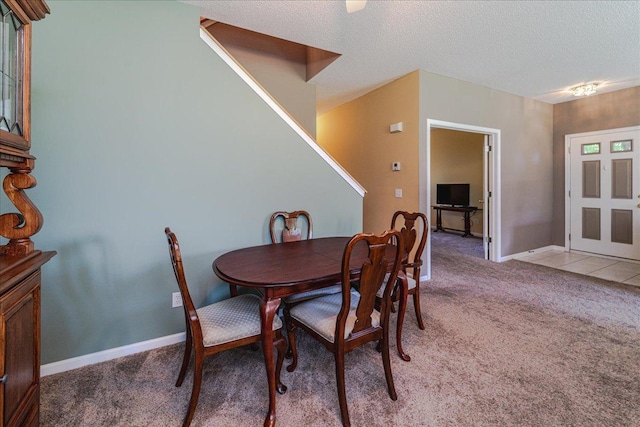 16901 90th Ct N, Maple Grove, MN 55311 - dining room featuring light colored carpet, a textured ceiling, and stairs