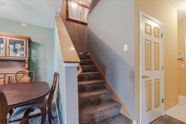 16901 90th Ct N, Maple Grove, MN 55311 - stairs featuring a textured ceiling and baseboards
