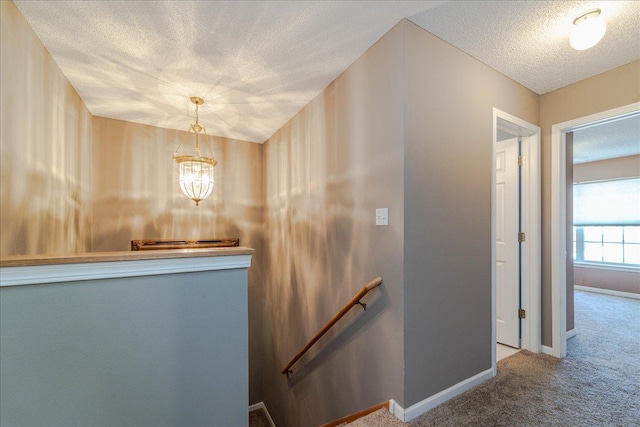 16901 90th Ct N, Maple Grove, MN 55311 - corridor featuring an upstairs landing, carpet floors, a textured ceiling, and a chandelier