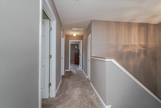 16901 90th Ct N, Maple Grove, MN 55311 - hallway featuring attic access, an upstairs landing, carpet floors, and a textured ceiling