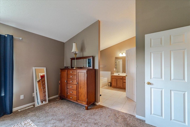 16901 90th Ct N, Maple Grove, MN 55311 - bedroom featuring light carpet, vaulted ceiling, and ensuite bath