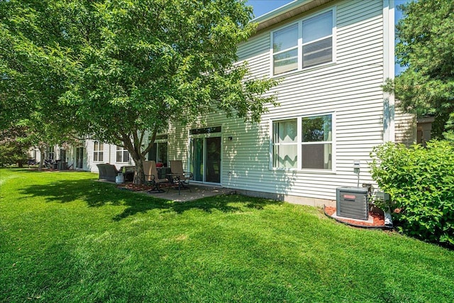 16901 90th Ct N, Maple Grove, MN 55311 - rear view of property with a lawn and a patio