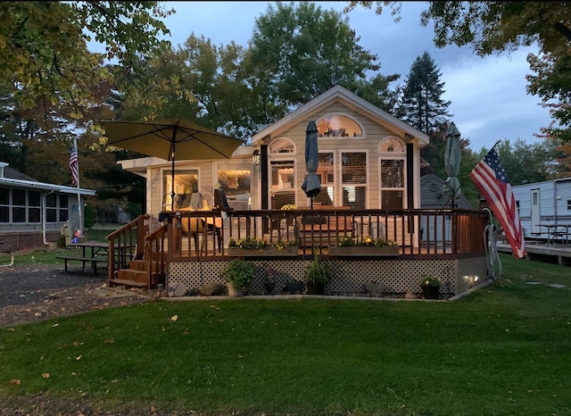25663 Circle Dr, Garrison, MN 56401 - back of house with a deck and a lawn