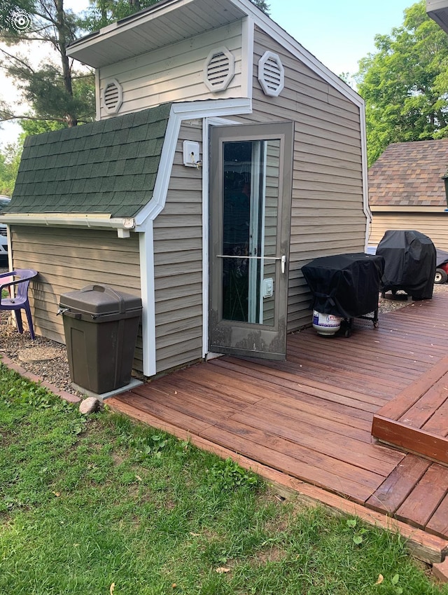 25663 Circle Dr, Garrison, MN 56401 - wooden terrace featuring grilling area and an outbuilding