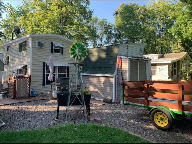 25663 Circle Dr, Garrison, MN 56401 - rear view of property featuring a shed and a shingled roof