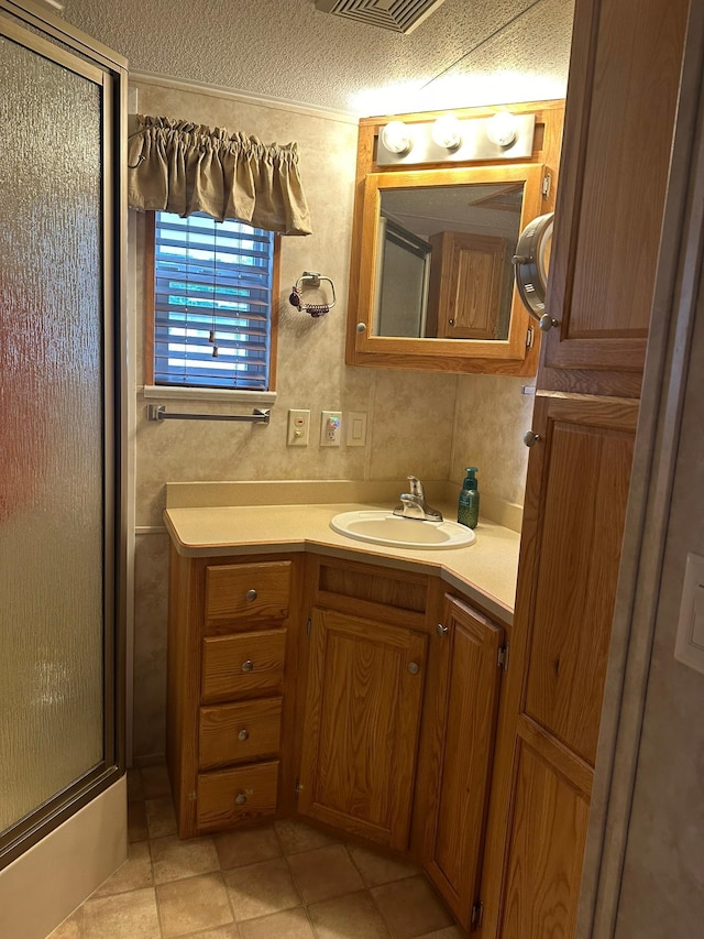 25663 Circle Dr, Garrison, MN 56401 - full bath with an enclosed shower, vanity, tile patterned floors, and a textured ceiling