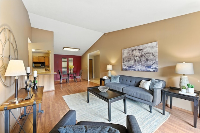 4151 Boone Ave N Unit 210, New Hope, MN 55427 - living area featuring light wood-style floors and vaulted ceiling