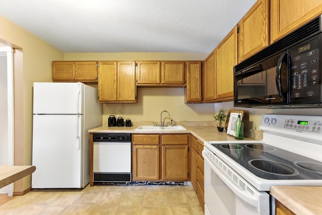 4151 Boone Ave N Unit 210, New Hope, MN 55427 - kitchen with white appliances, light countertops, brown cabinetry, and a textured ceiling