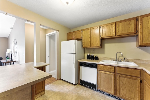 4151 Boone Ave N Unit 210, New Hope, MN 55427 - kitchen with white appliances, light countertops, brown cabinets, and a textured ceiling