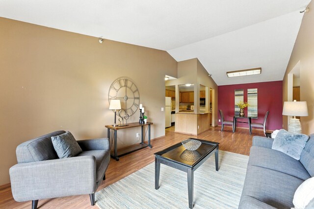 4151 Boone Ave N Unit 210, New Hope, MN 55427 - living room featuring vaulted ceiling and light wood finished floors
