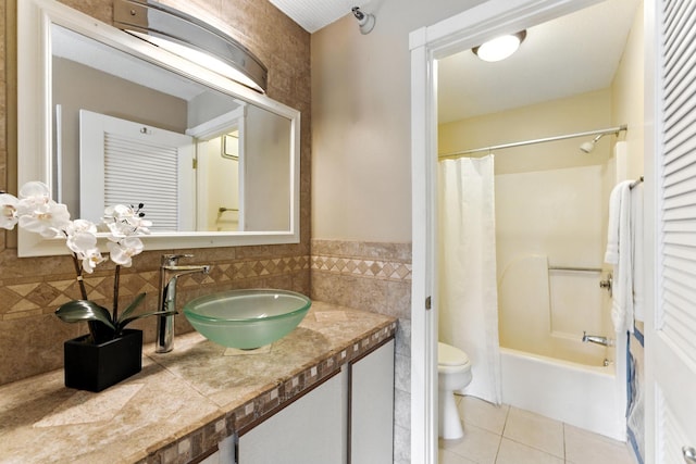 4151 Boone Ave N Unit 210, New Hope, MN 55427 - full bath with tile patterned floors, tile walls, shower / bath combo with shower curtain, vanity, and wainscoting