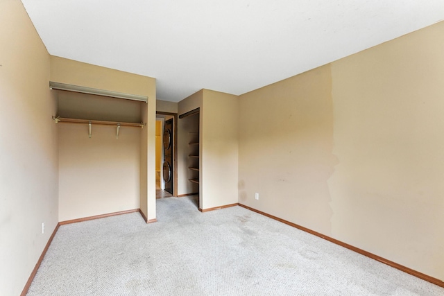 4151 Boone Ave N Unit 210, New Hope, MN 55427 - unfurnished bedroom with carpet flooring, stacked washer and clothes dryer, and a closet