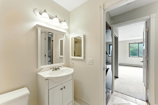 4151 Boone Ave N Unit 210, New Hope, MN 55427 - bathroom featuring vanity, a baseboard radiator, and tile patterned flooring