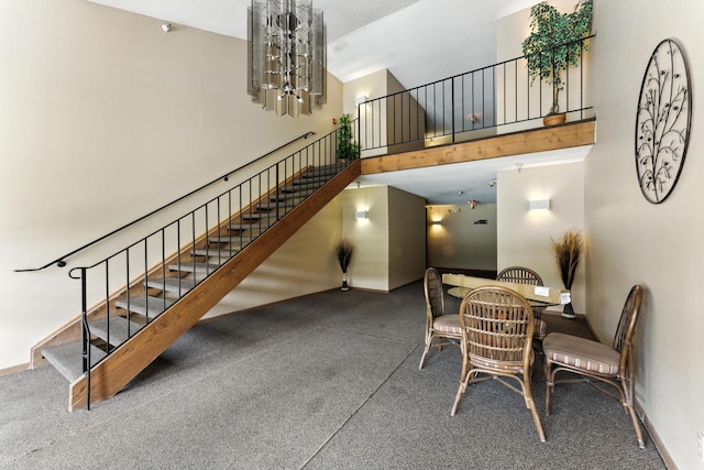 4151 Boone Ave N Unit 210, New Hope, MN 55427 - dining area featuring a towering ceiling, stairway, a chandelier, and carpet