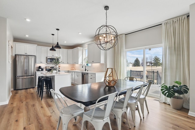 2878 Kama Ave NE, Saint Michael, MN 55376 - dining space with plenty of natural light, a chandelier, light wood-type flooring, and recessed lighting
