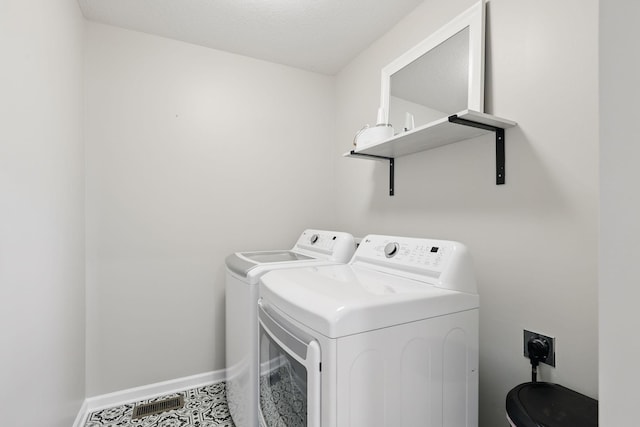 2878 Kama Ave NE, Saint Michael, MN 55376 - laundry room featuring washer and dryer and tile patterned floors