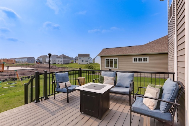 2878 Kama Ave NE, Saint Michael, MN 55376 - wooden deck featuring a lawn, a residential view, and an outdoor living space with a fire pit