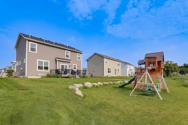 2878 Kama Ave NE, Saint Michael, MN 55376 - back of house featuring a playground, a yard, and a deck