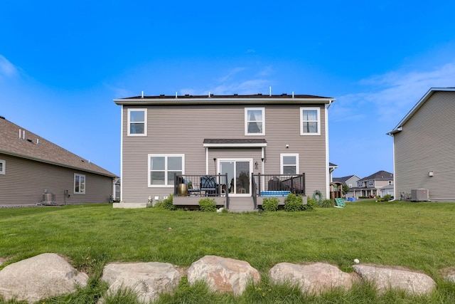 2878 Kama Ave NE, Saint Michael, MN 55376 - back of property with a deck and a lawn