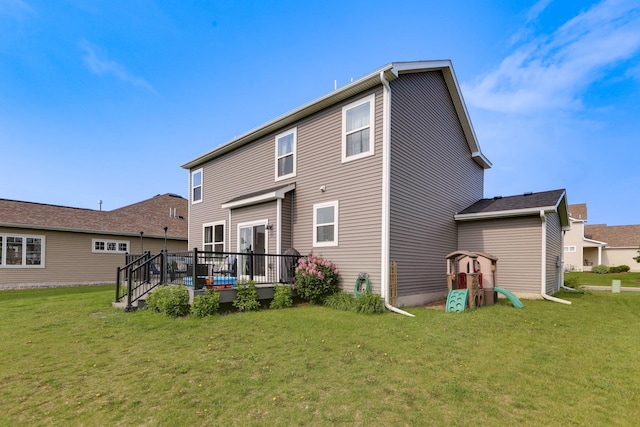 2878 Kama Ave NE, Saint Michael, MN 55376 - rear view of property with a yard and a wooden deck