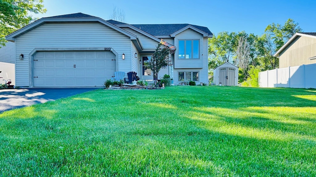 2513 Crestmount Ln, Burnsville, MN 55306 - tri-level home featuring a shed, a garage, and asphalt driveway