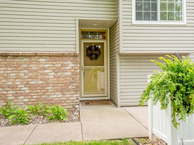 6388 Tahoe Rd, Woodbury, MN 55125 - doorway to property featuring brick siding