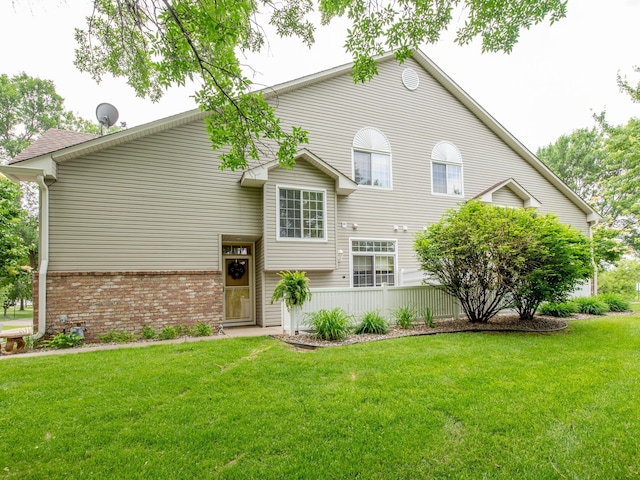 6388 Tahoe Rd, Woodbury, MN 55125 - view of front of house featuring a front yard and brick siding