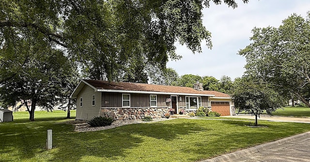 112 Orchard Cir, Montevideo, MN 56265 - ranch-style home with covered porch, board and batten siding, a garage, a front lawn, and stone siding